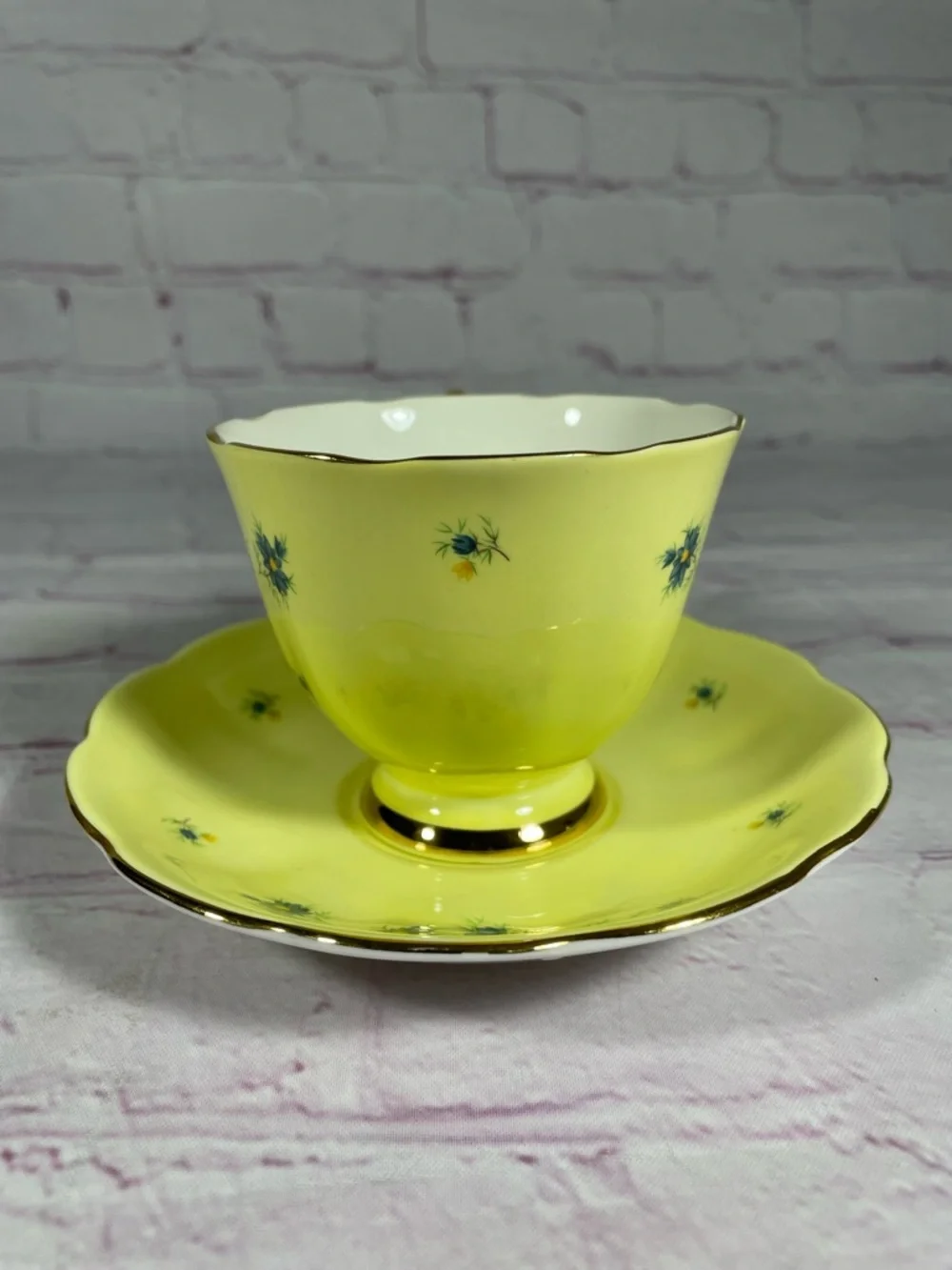Vintage Yellow and Blue Floral Gold Trim Bone China Footed Teacup and Saucer Set